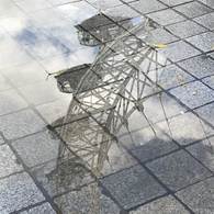 A reflection of a tower in a puddle of water

AI-generated content may be incorrect.