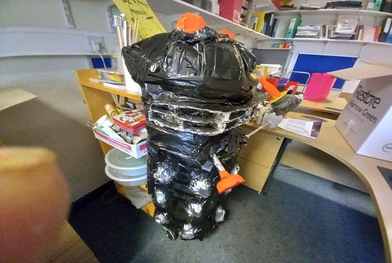 A hand holding a black and silver object
AI-generated content may be incorrect.