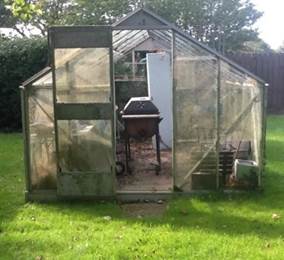 Figure 3a. Photograph of a dirty greenhouse.