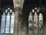 A stained glass window in a church

Description automatically generated